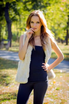 Young, beautiful woman in the city park