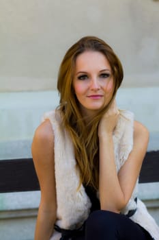 Young, beautiful woman in the city park