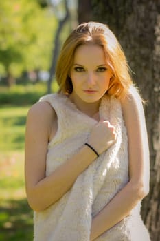 Young, beautiful woman in the city park