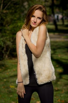 Young, beautiful woman in the city park