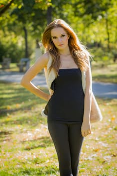 Young, beautiful woman in the city park