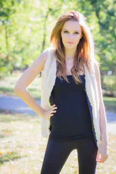 Young, beautiful woman in the city park