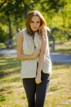 Young, beautiful woman in the city park