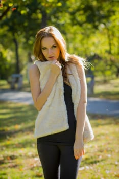 Young, beautiful woman in the city park