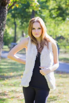 Young, beautiful woman in the city park