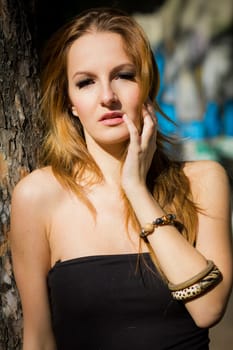 Young, beautiful woman in the city park