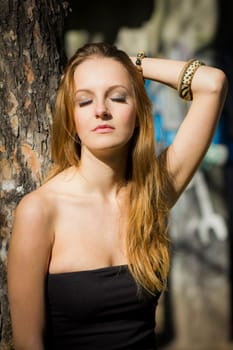 Young, beautiful woman in the city park