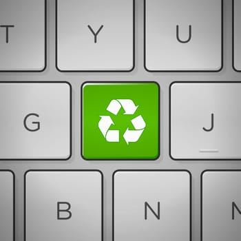 Recycling green sign on keyboard close up