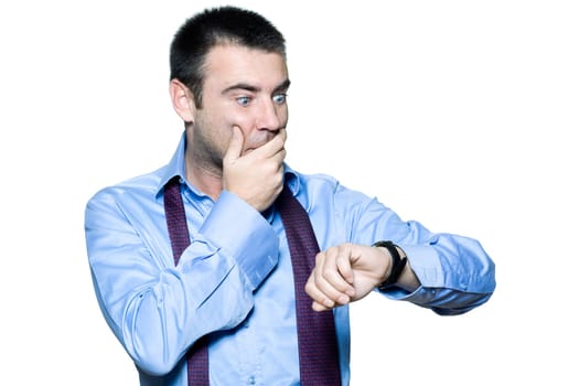 Portrait of an expressive businessman late for work, looking at his watch on isolated white background