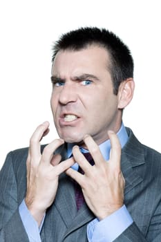 Closeup portrait of an expressive angry mature man in studio on isolated white background