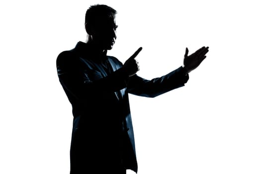 one caucasian man angry menacing portrait silhouette in studio isolated white background