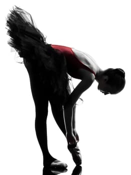 one caucasian young woman ballerina ballet dancer dancing with tutu in silhouette studio on white background