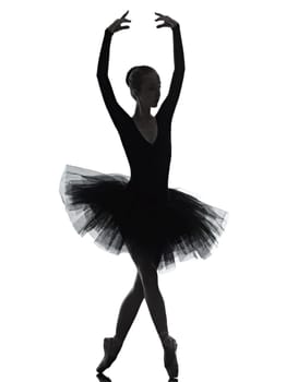 one caucasian young woman ballerina ballet dancer dancing with tutu in silhouette studio on white background