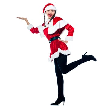 one woman dressed as santa claus product placement showing empty hand on studio isolated white background
