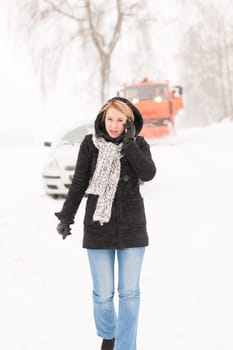 Woman calling for help broken car snow assistance winter road