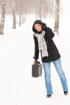 Woman holding gas can snow car trouble winter road breakdown