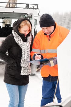 Woman answering inquiry broken car snow mechanic assistance road winter