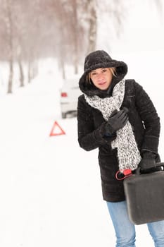 Woman holding gas can snow car breakdown winter help road