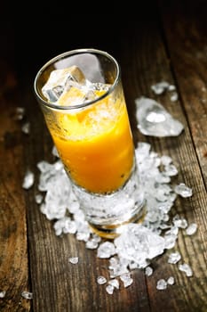 Hard Liquor Orange Juice Shooter on a countertop with crushed ice and alcohol for drink concepts look at my portofolio