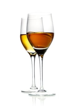 Two glasses of hard liquor aperitif isolated on white