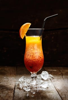 Sex on the beach Drink on a countertop in a bar. With wood background