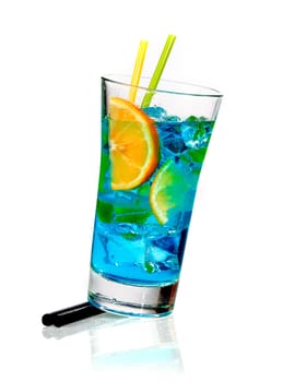 Tall glass of blue blended curacao cocktail with orange slices and ice cubes coneptual of a celebration or a tropical vacation