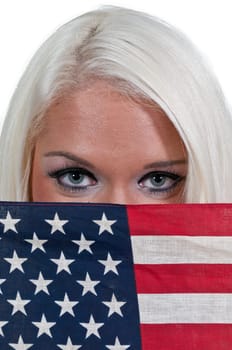 A beautiful young woman holding an American flag.