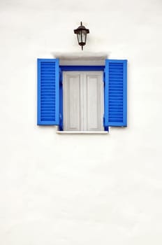 Blue window on white wall
