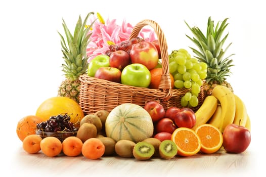 Composition with assorted fruits in wicker basket isolated on white