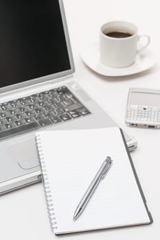 Business workplace pen notepad laptop phone coffee on office desk