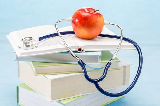 Stethoscope and apple medical healthcare healthy lifestyle doctor book