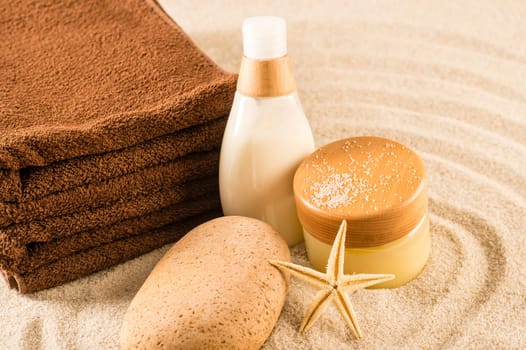 Spa beauty treatment products on sand natural body care