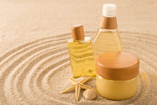 Summer care body skin product on sand seashell star