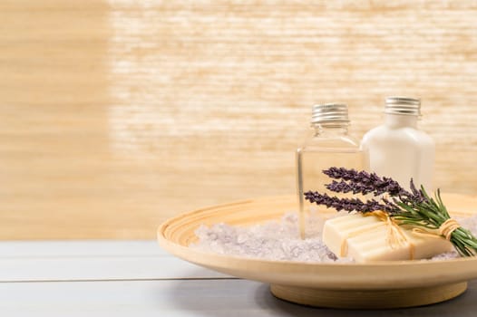 Natural spa products lavender on wooden tray