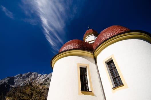 Church in St. Bartolomä with red roof at Königssee