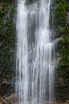 Waterfall with green moss in the Wimbachklamm