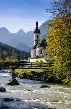 Church in Ramsau,Bavaria,on the stream surrounded by mountains