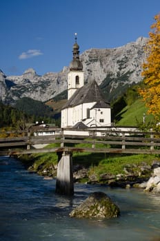 Church in Ramsau with the mountains of the Reiteralpe in portrait format