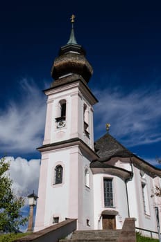 Church with church tower in Maria Gern near Berchtesgaden with blue sky