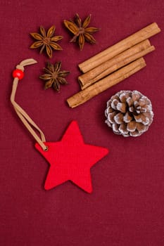 Red heart with cinnamon sticks,star anise and pine cones