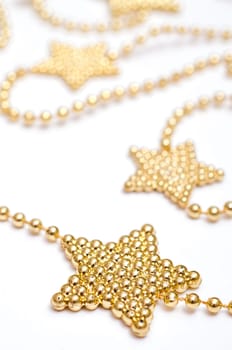Poinsettia made of golden pearls on a chain