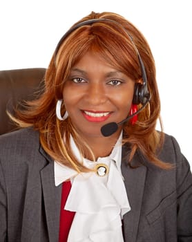 An African American woman is wearing a headset