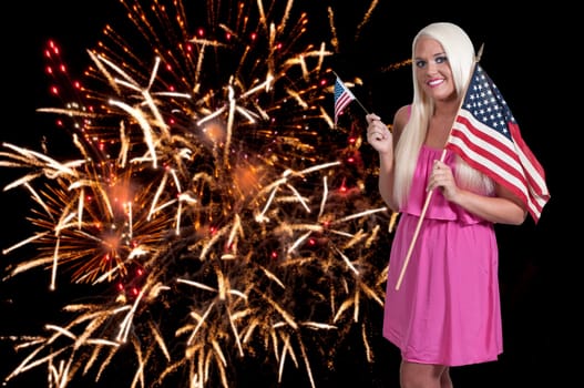Beautiful woman holding a US flag at a fireworks display
