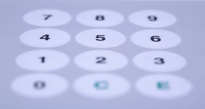 Wide white buttons on working desktop partially shaded