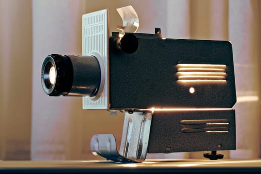 Working  metal projector on table top radiating heat