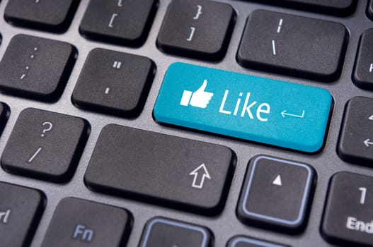 A like message on enter keyboard for social media concepts.