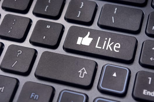 A like message on enter keyboard for social media concepts.