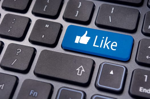 A like message on enter keyboard for social media concepts.