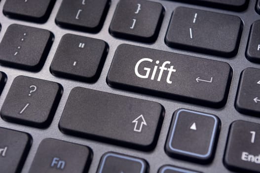 Gift concepts or buying a gift online, with a message on keyboard enter key.