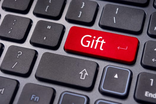 Gift concepts or buying a gift online, with a message on keyboard enter key.